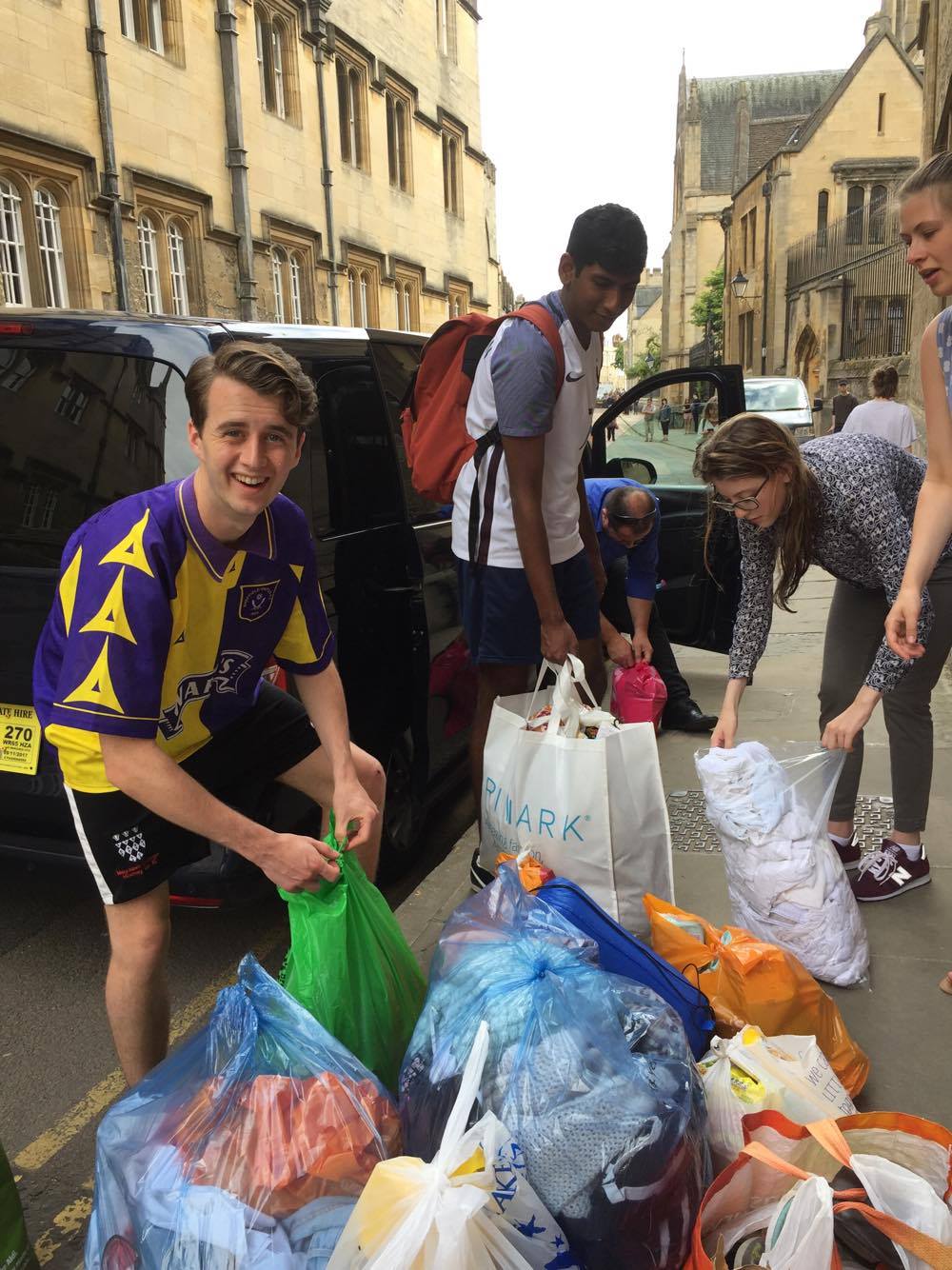 Students transporting donated goods